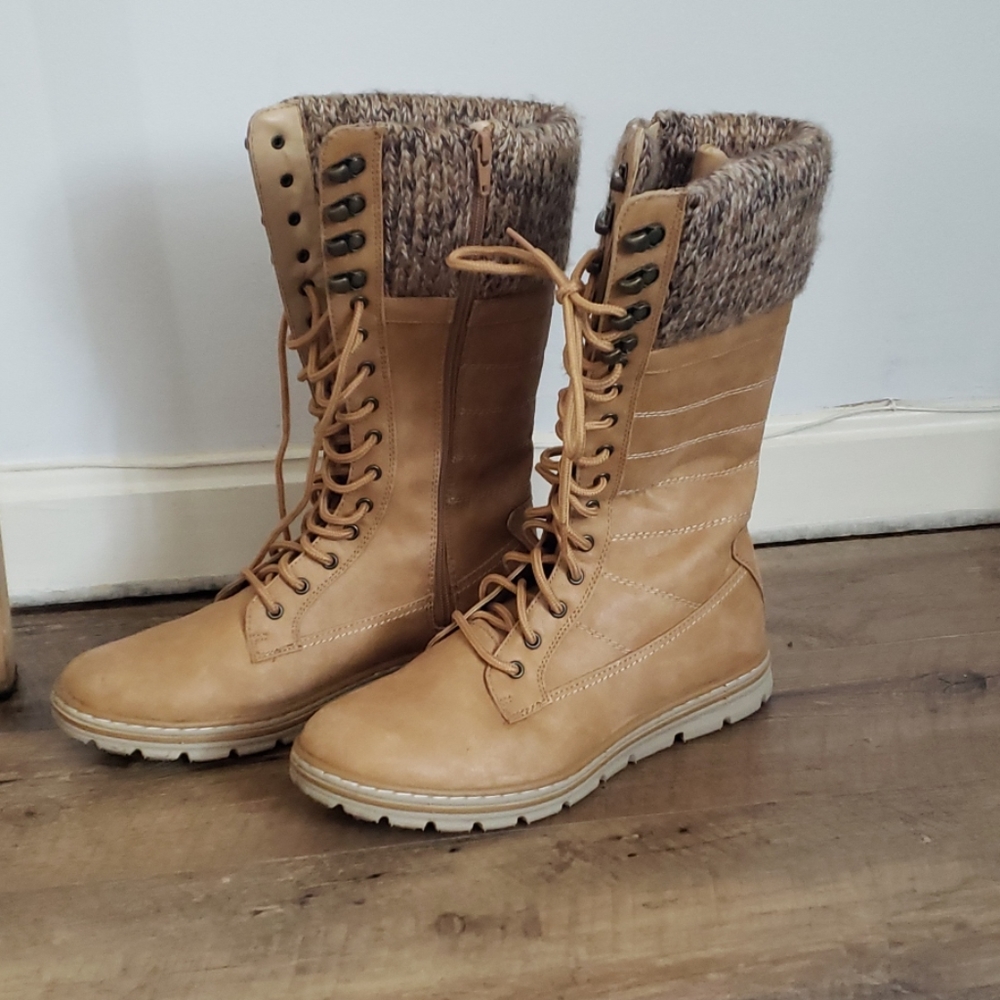 Light brown mid calf boots.